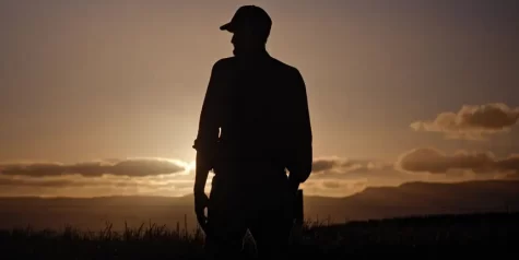 Tasmanian Farmer Standing at Sunset